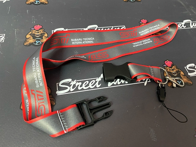 картинка Шнурок для ключей STI "тканевый", серый магазин  StreetTuning 