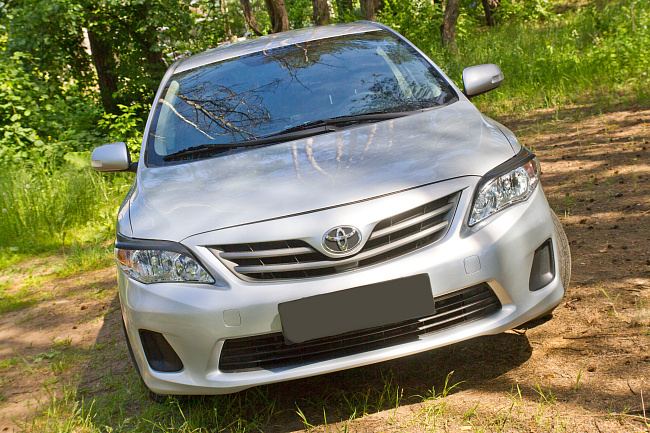 картинка Toyota Corolla (седан) 2010-2013 Накладки на передние фары (реснички) магазин  StreetTuning 